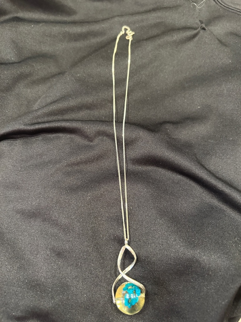 Sterling Silver Infinity Pendant Necklace with Resin Turquoise Flower Accent